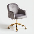 Chaise de bureau en velours gris avec base métallique dorée et roulettes